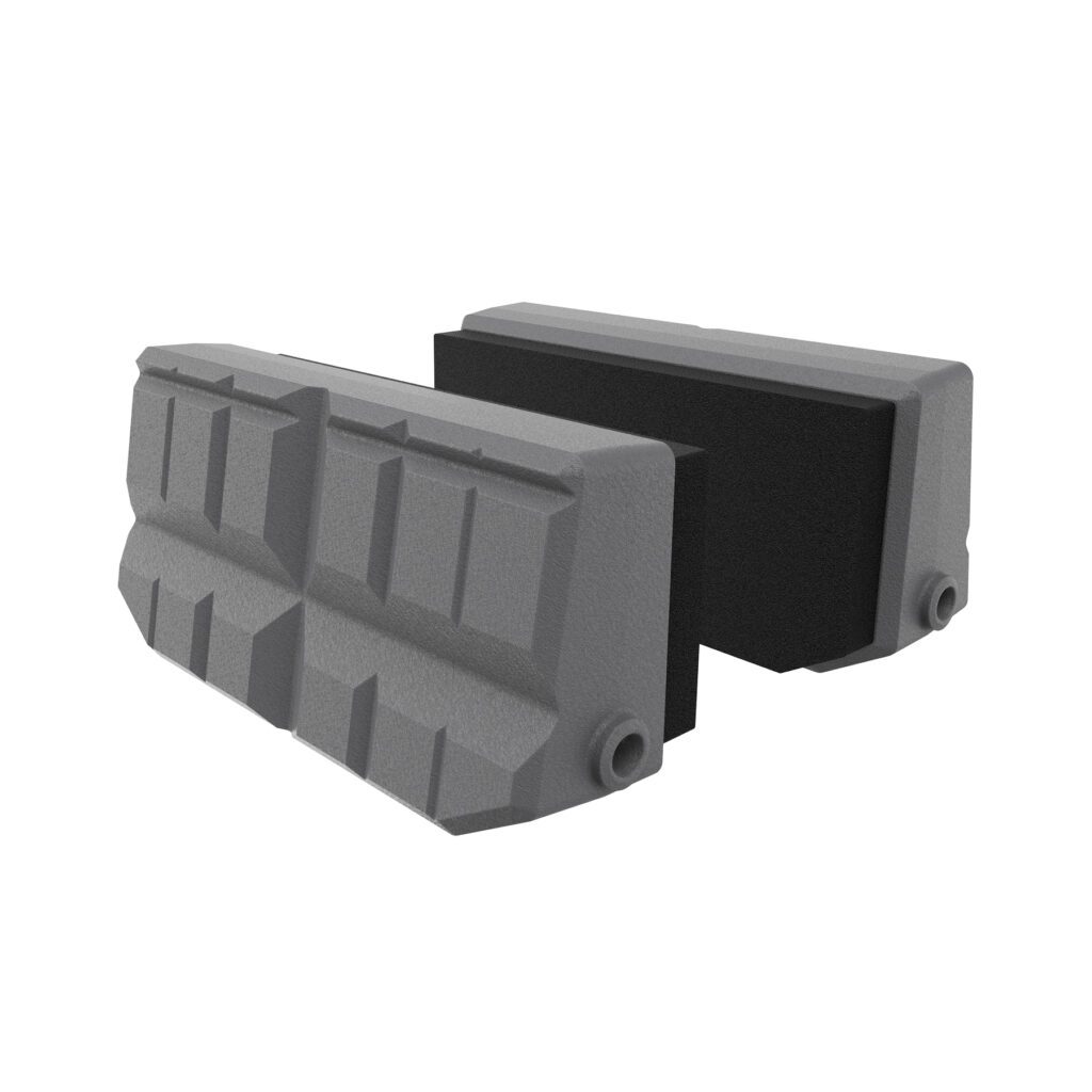 two black and gray plastic blocks on a white background