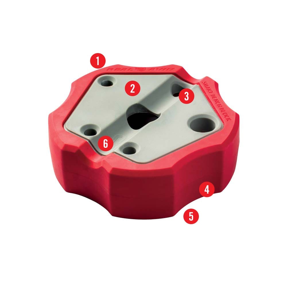 a red plastic tool holder with four holes
