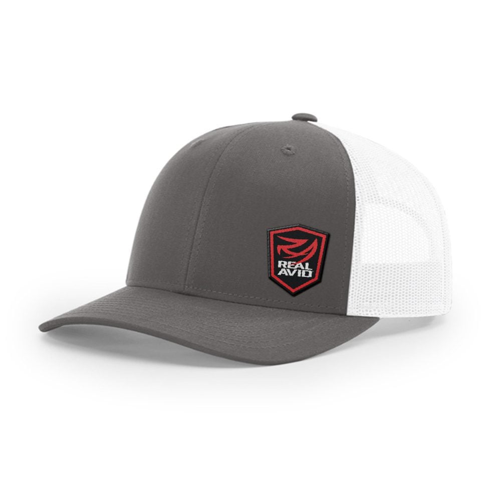 a gray and white trucker hat with a red patch on the front