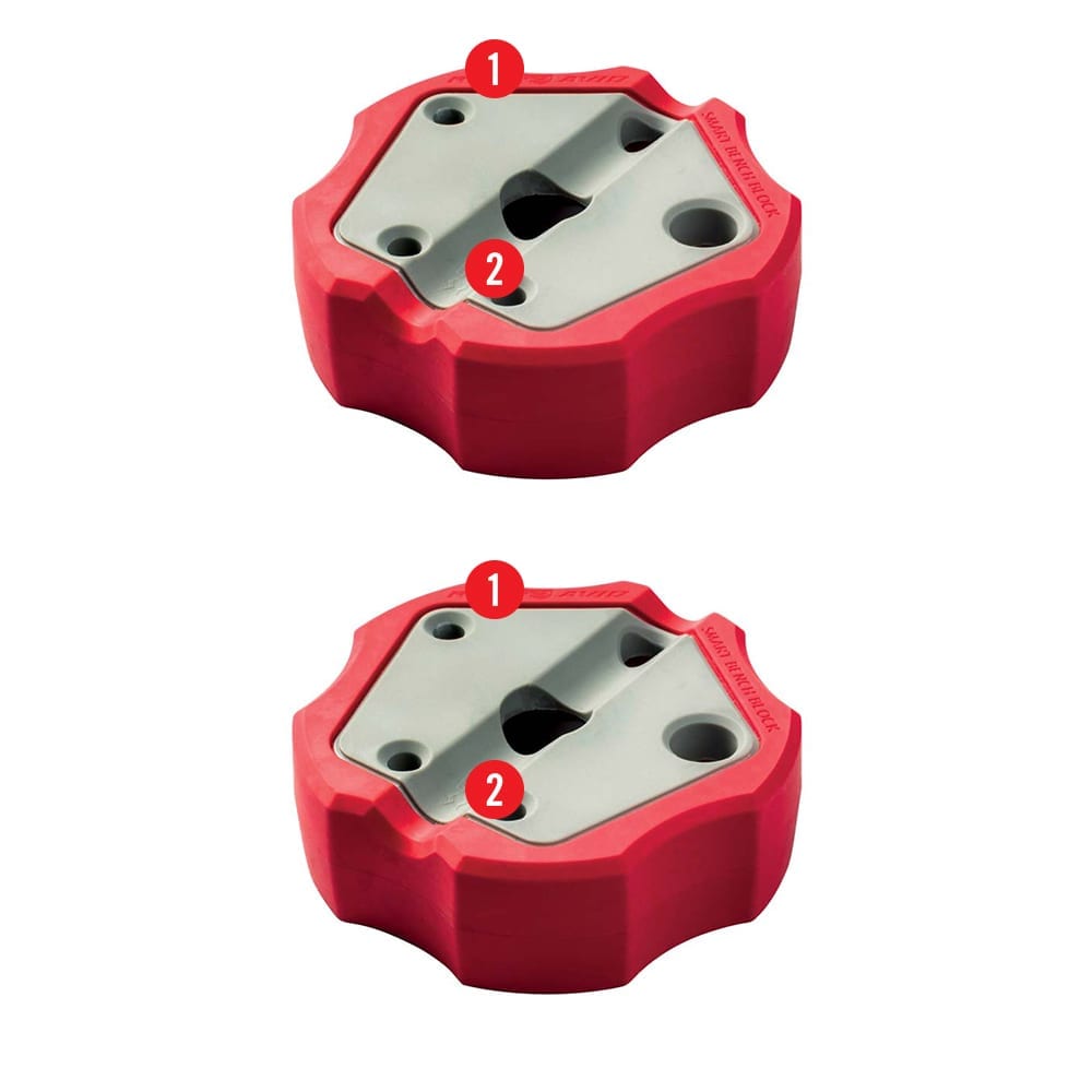 two red and white plastic parts for a machine
