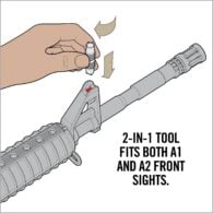 a hand is holding a small tool and pointing at it