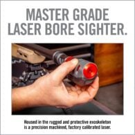 a hand holding a flashlight with the words master grade laser bore sighter
